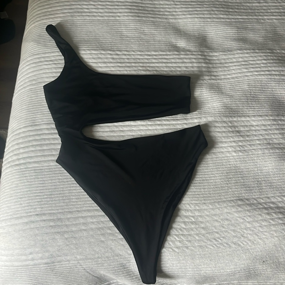 Naked swimwear, one piece. Super cute cut out. Size medium and in good condition